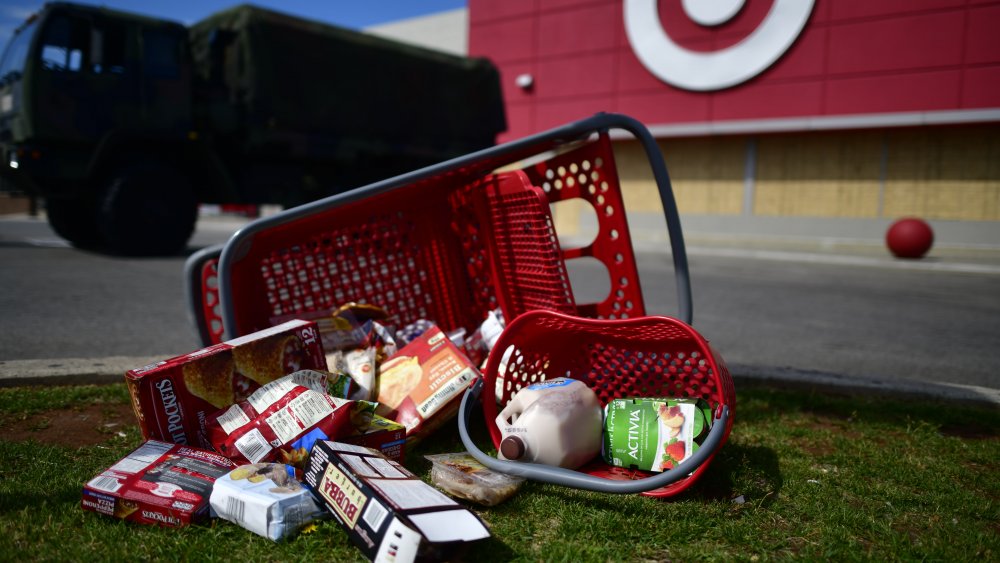 Groceries lie scattered on the ground in the aftermath of looting as members of the Pennsylvania National Guard monitor activity outside a shuttered Target store on June 3, 2020 in Philadelphia, Pennsylvania.