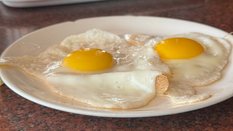 Fried eggs cooked in the microwave, sunny side up