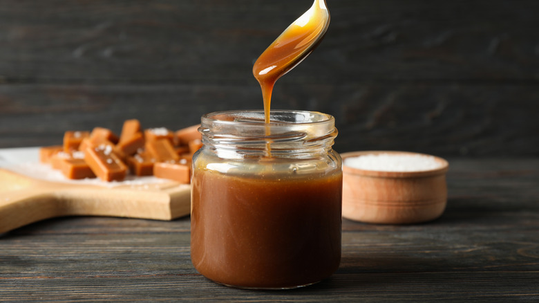 Homemade caramel sauce in glass jar