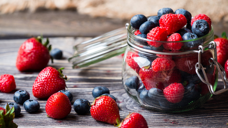 Blueberries and strawberries in jar