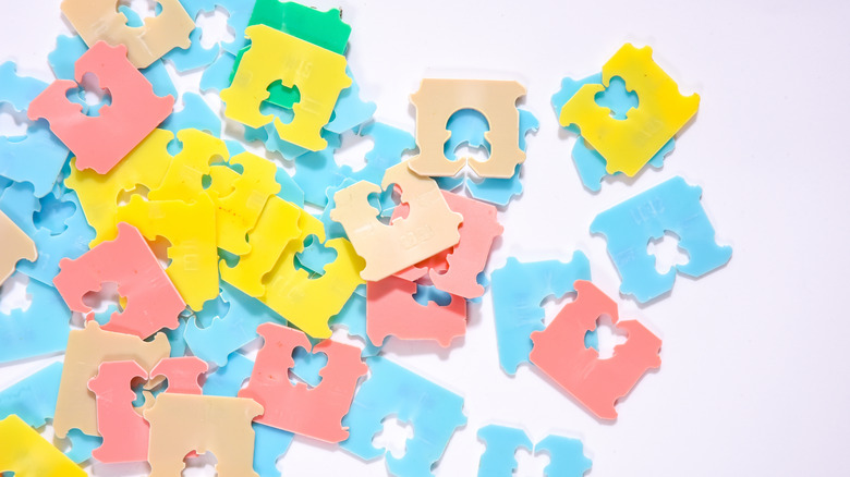 An assortment of bread tags on white background