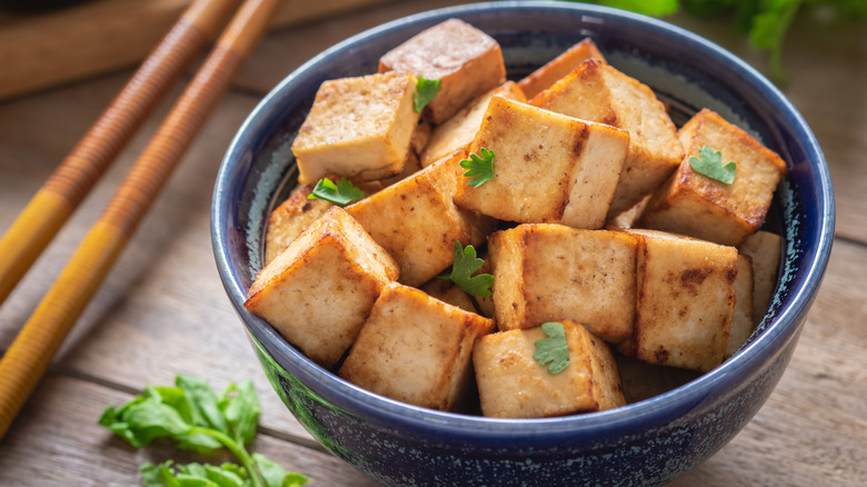 A bowl of crispy tofu cubes