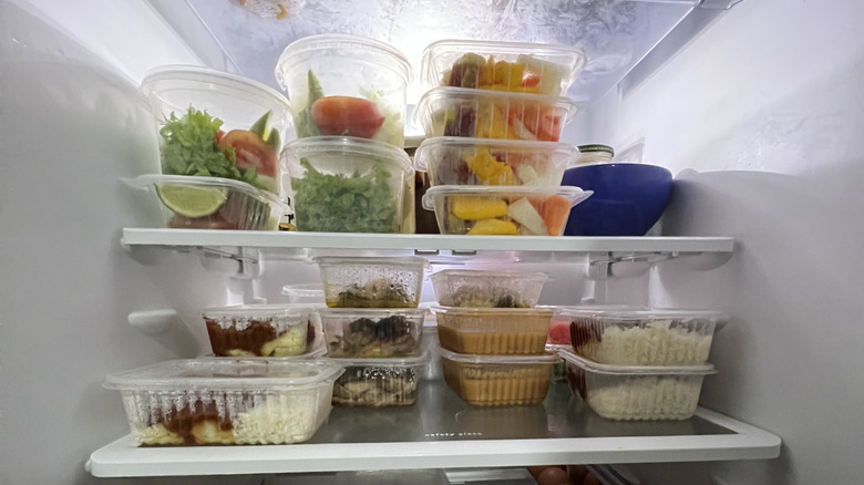 A fridge with clamshell containers used for organizing food