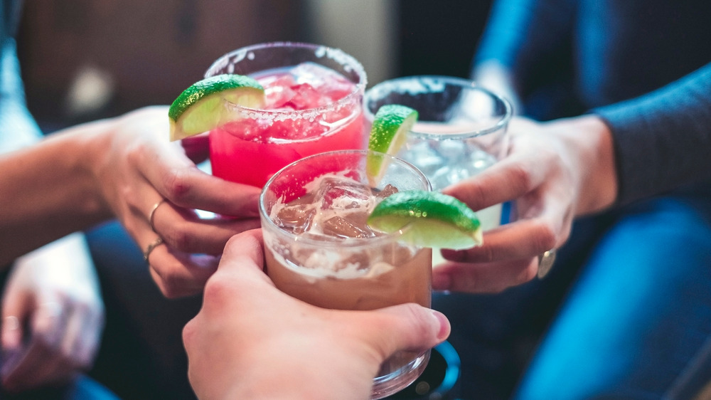 Friends toasting with cocktails