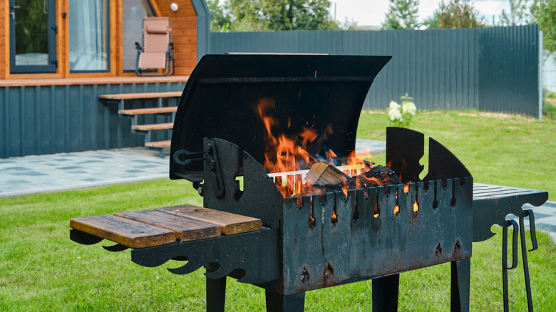 Open smoker burning wood