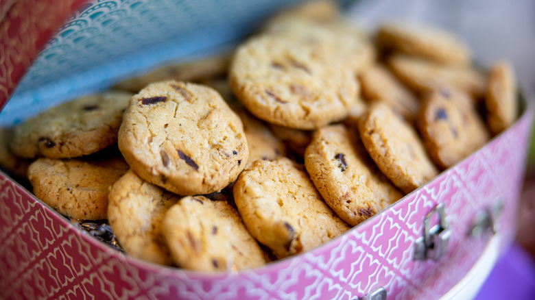 cookie tin filled with chocolate chip cookies