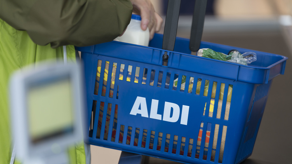 A shopper with a cart from Aldi