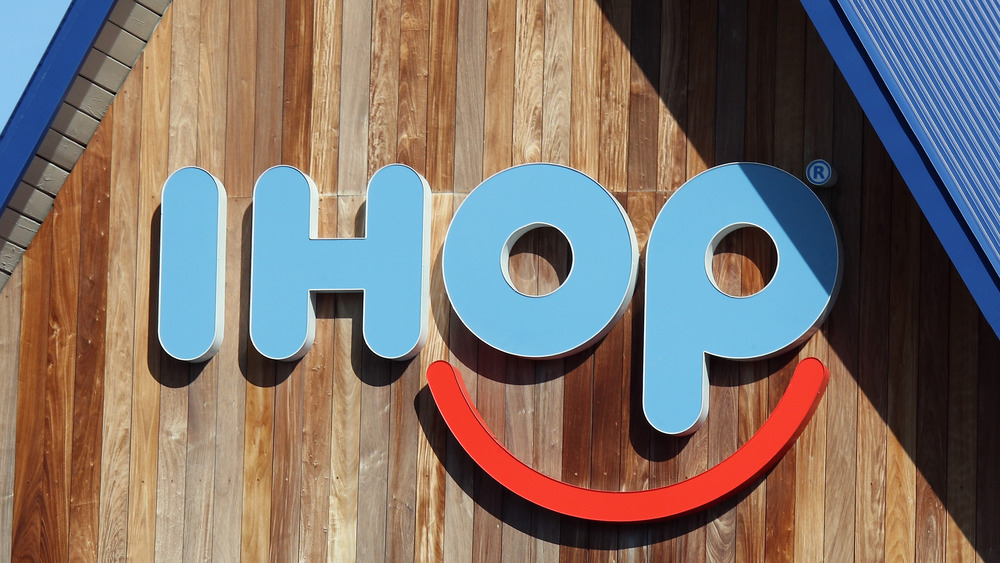 Traditional IHOP restaurant sign in blue and red