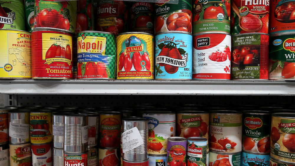 Canned tomatoes on a shelf