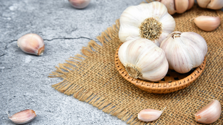 Garlic cloves and bulbs in a basket