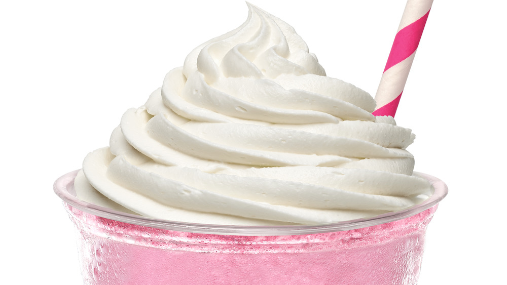 Pink milkshake with straw