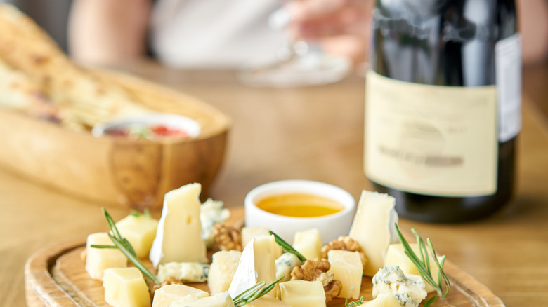 cheese on board with wine