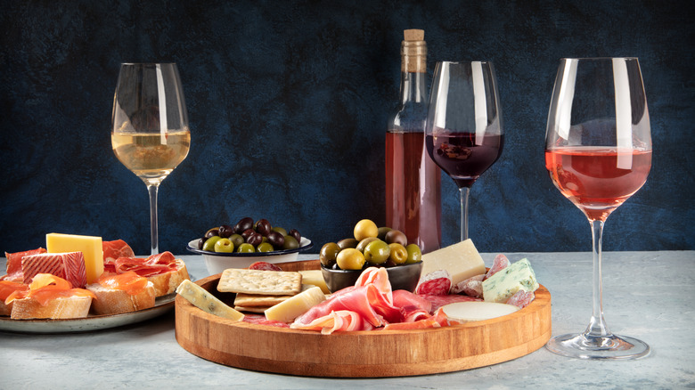 cheese board with wine glasses