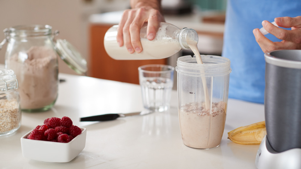 Man making protein shake