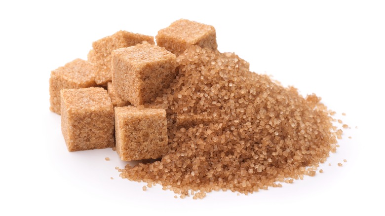 Brown sugar on white background 