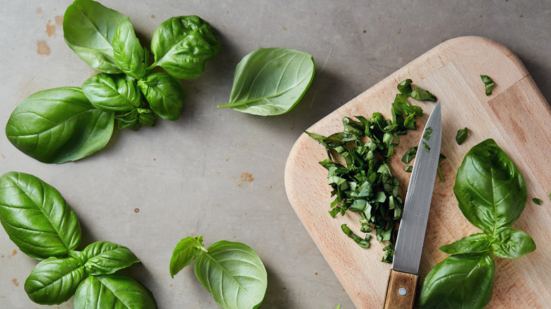 Freshly chopped basil on cutting board