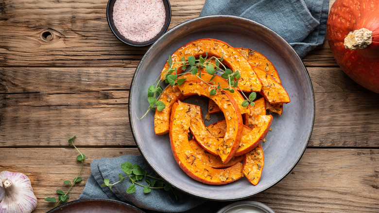 pumpkin slices, garnished with microgreens