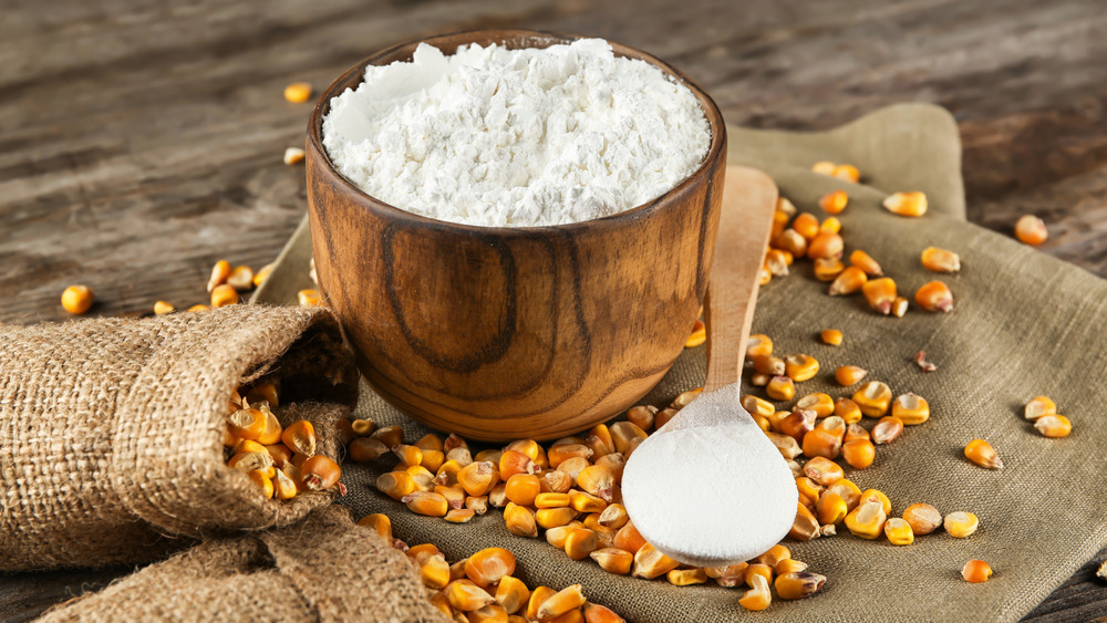 Bowl of cornstarch with corn kernels