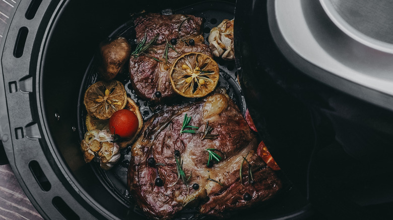 Steak in an air fryer basket