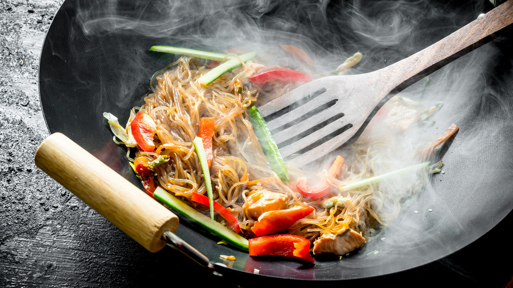 Steaming wok with food in it