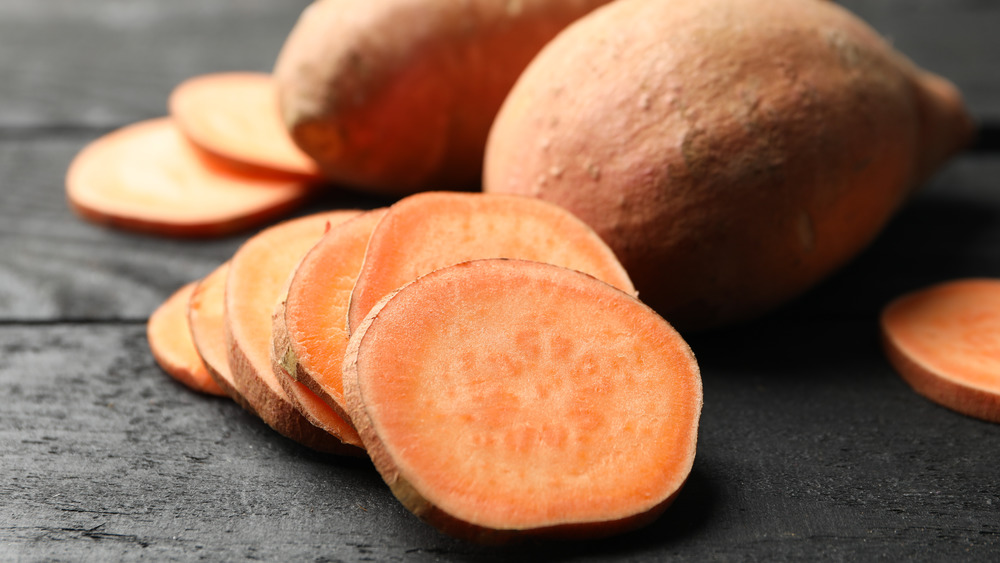 Sliced and whole sweet potatoes