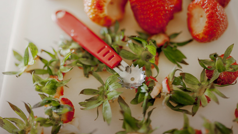 Strawberry huller and hulls