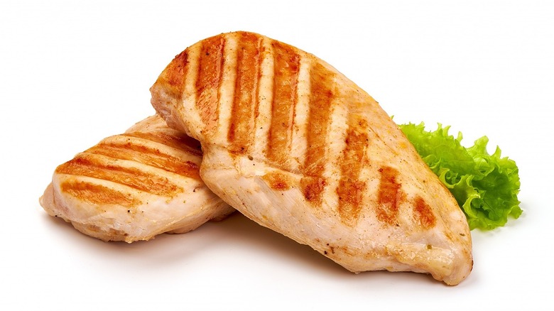 two grilled chicken breasts