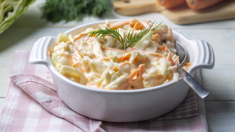 Bow of coleslaw with dill garnish