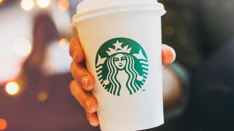 Starbucks cup with hand