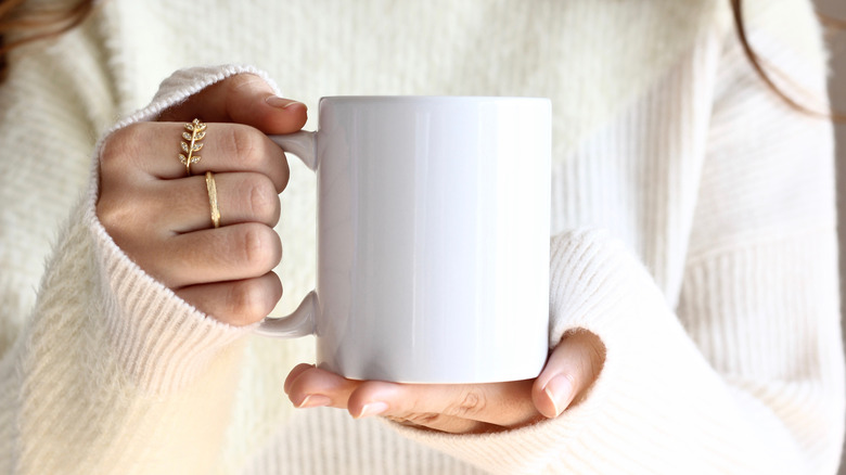 woman holding a cup of coffee