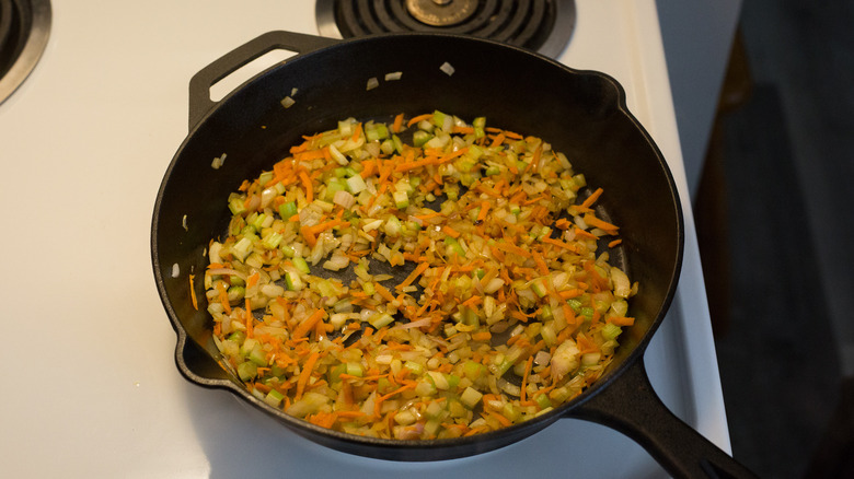 vegetables cooking in iron pan
