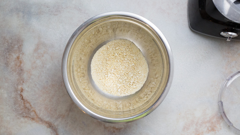 ground cashews in mixing bowl