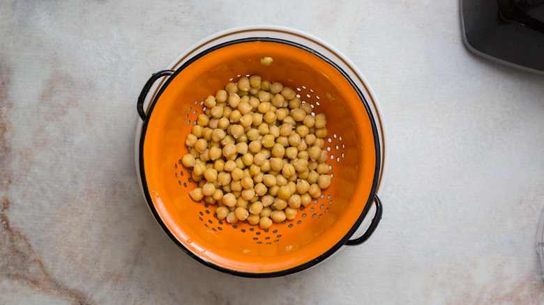 chickpeas in orange colander