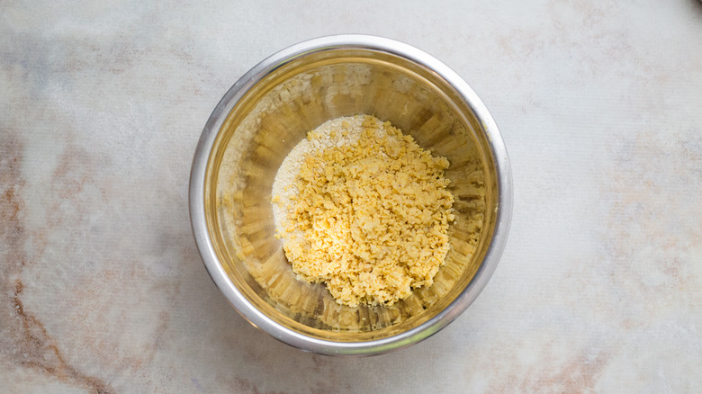 Ground chickpeas and cashews in bowl