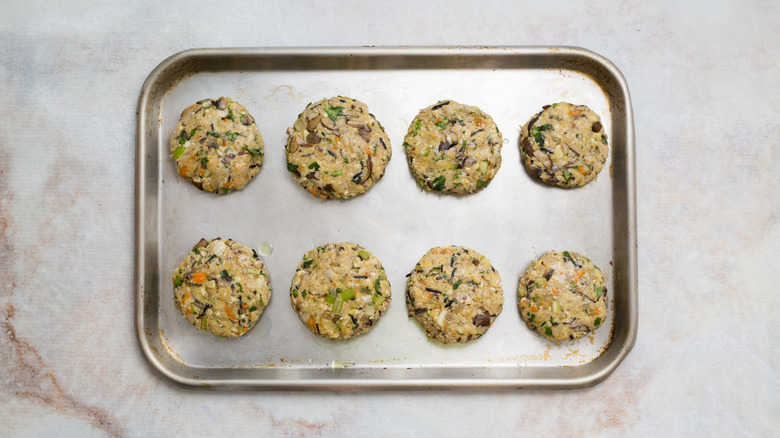 uncooked veggie burgers in pan