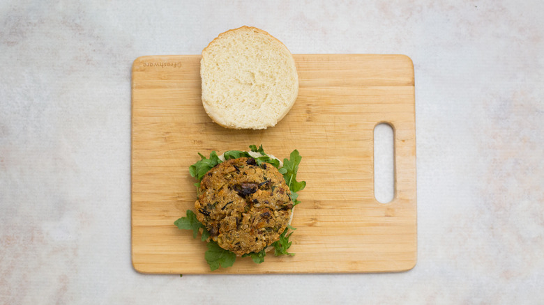 veggie burger on wooden board