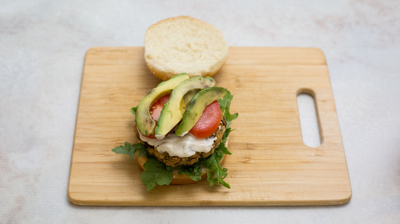 veggie burger on wooden board