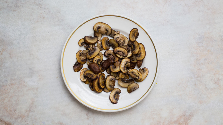 cooked mushrooms on white plate