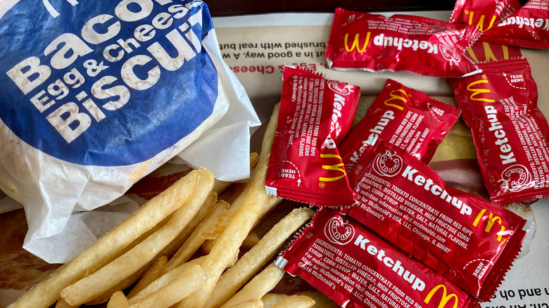 McDonald's breakfast sandwich, fries, ketchup