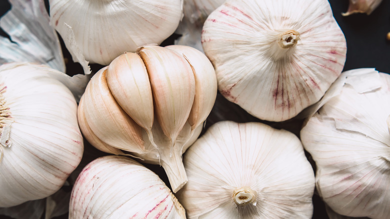 Three white garlic bulbs