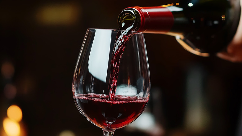 Pouring a glass of red wine