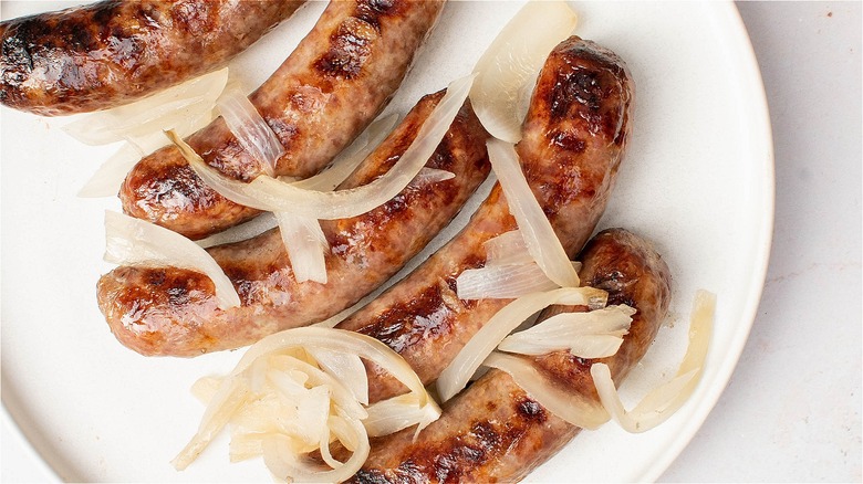 brats and onions on plate