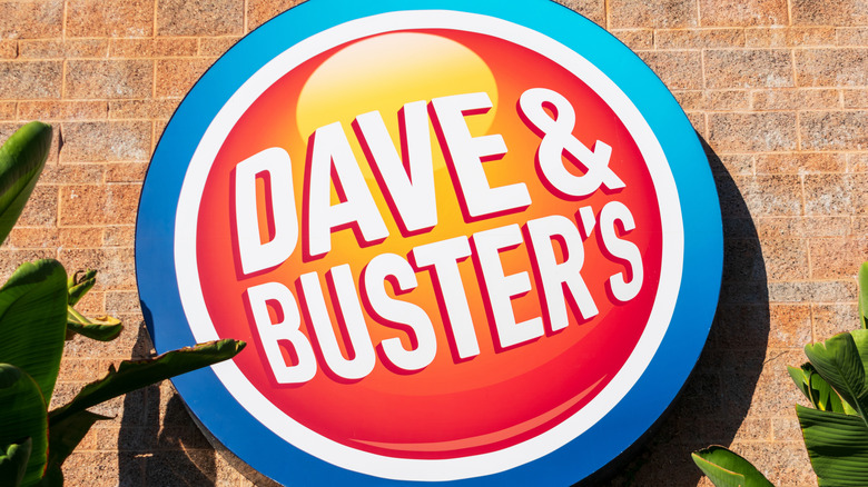 Dave & Buster's sign on stone wall