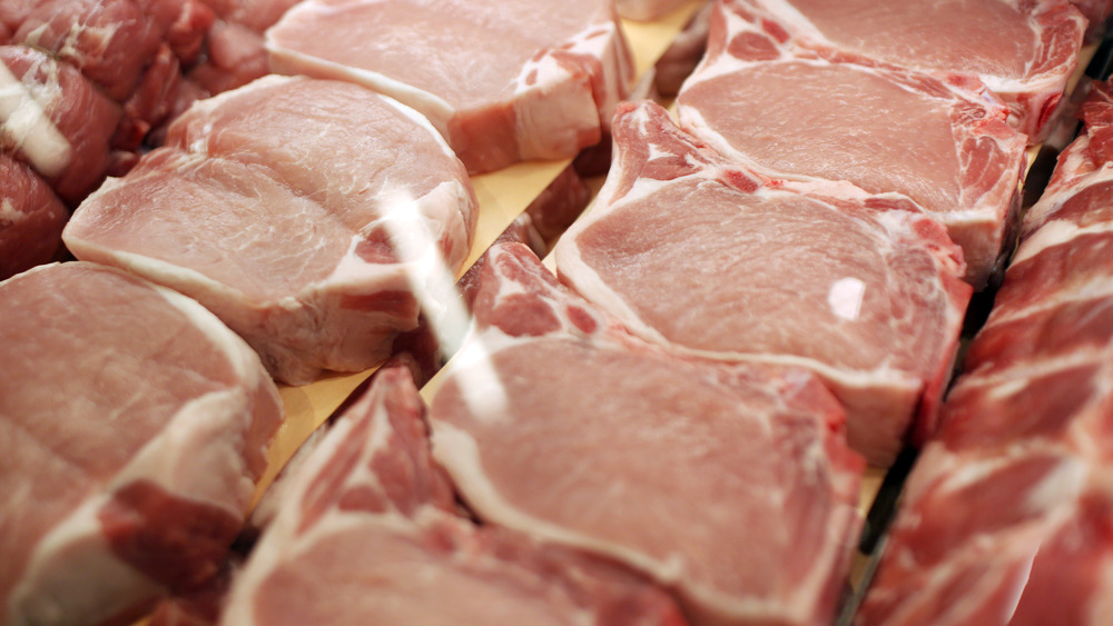 Pork chops in supermarket meat case