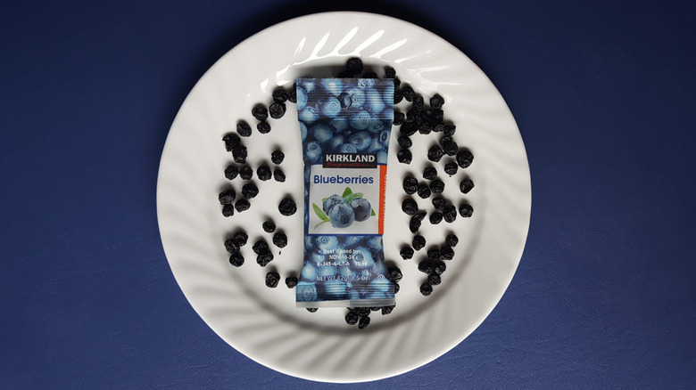 Kirkland blueberries package and dried blueberries on plate