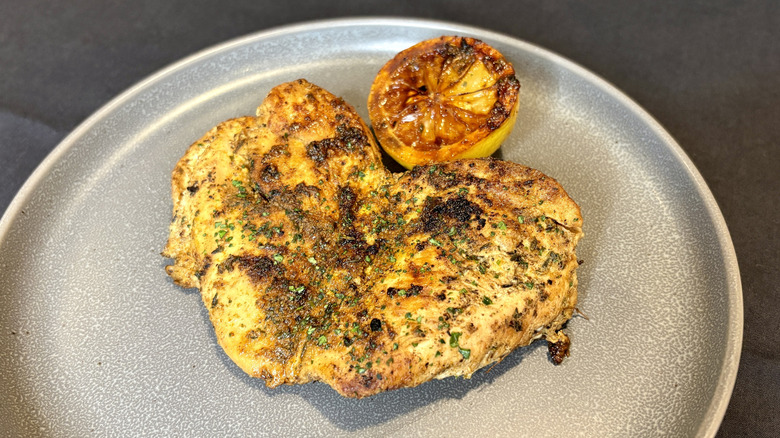 Texas Roadhouse herb-crusted chicken on plate