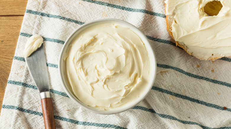 Cream cheese in tub on towel
