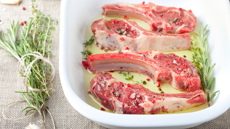 marinating pieces of lamb