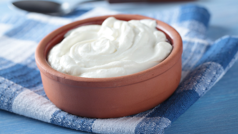 Greek yogurt cup on blue gingham