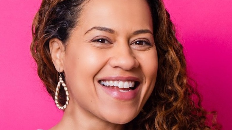 Yolanda Gampp headshot with earrings